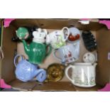 A collection of Wade including Novelty Teapots, Andy Cap Teapot, Toast Rack etc These were removed
