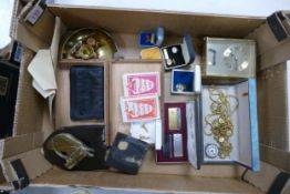 A mixed collection of items to include cufflinks, mantle clock, lighters , brass ware watch, costume