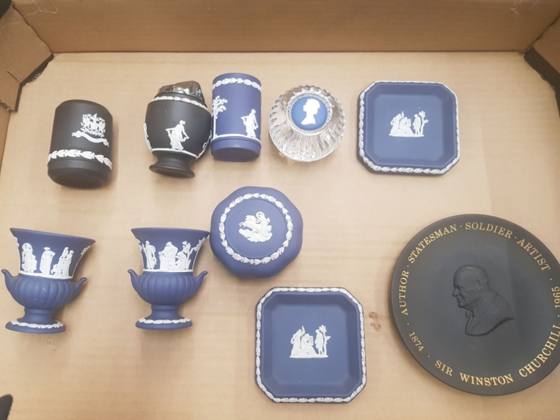 A collection of Wedgwood black and queens blue jasperware items to include table lighter, small