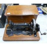 19th century Bradbury sewing machine in mahogany case, base split