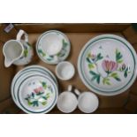 A collection of Portmerion Magnolia tea and dinner ware to include shallow bowls, cups, saucers,