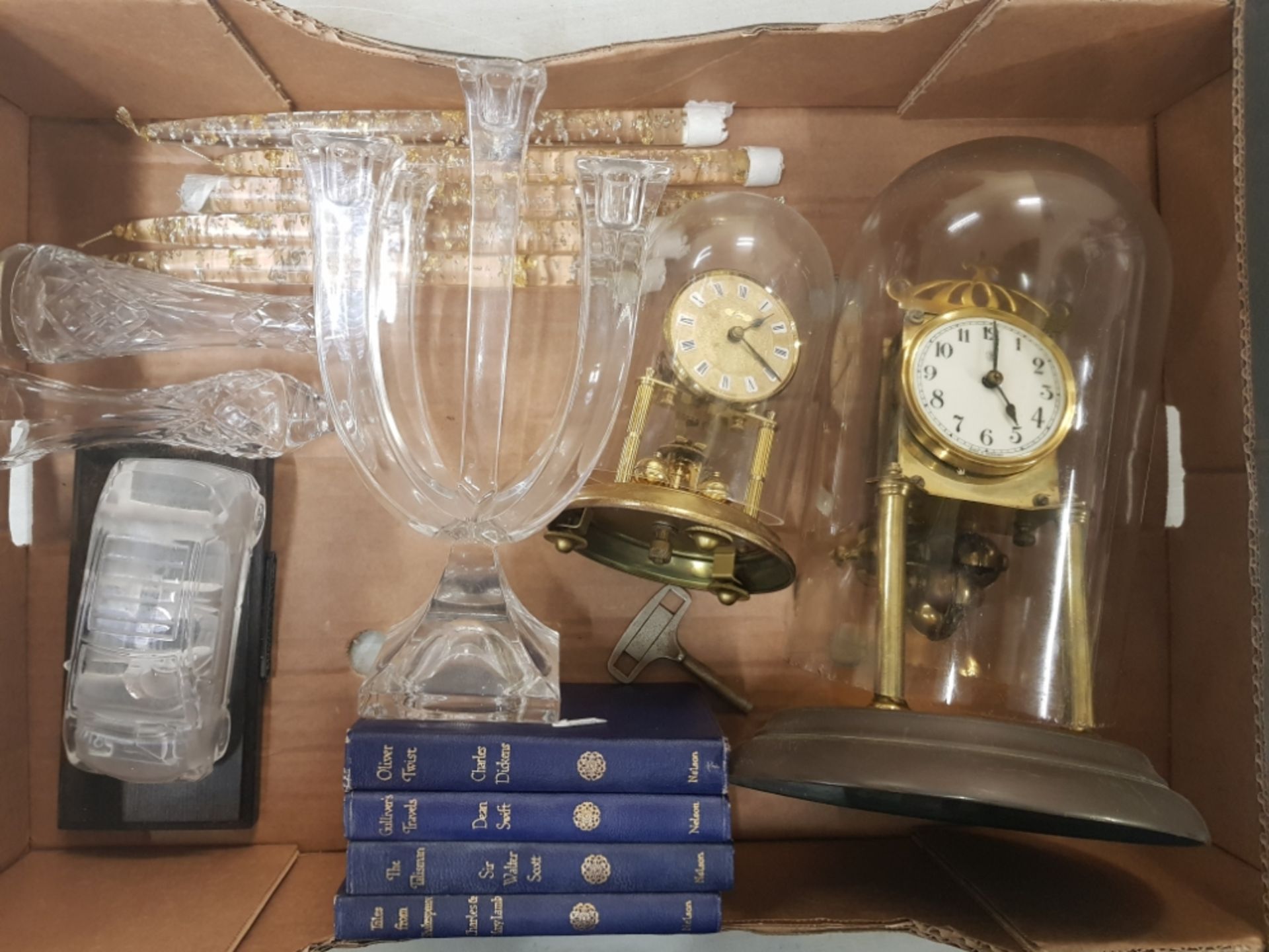 A mixed collection of items to include 2 Anniversary Clocks, glass candelabra, crystal bud vases,