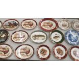 A large collection of decorative wall plates mostly 'Weatherby Hanley' examples with wildlife