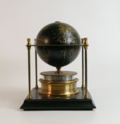 Royal Geographical Society world clock with gilt and black decoration on a wooden stand. 28cms