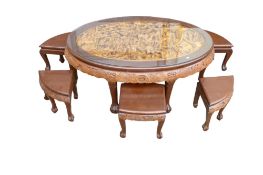South Asian carved hardwood oval glass topped coffee table with six matching stools. Length 119cm,