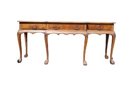Walnut carved break fronted 3 drawer serving table on ball & claw feet, circa 1920's, length