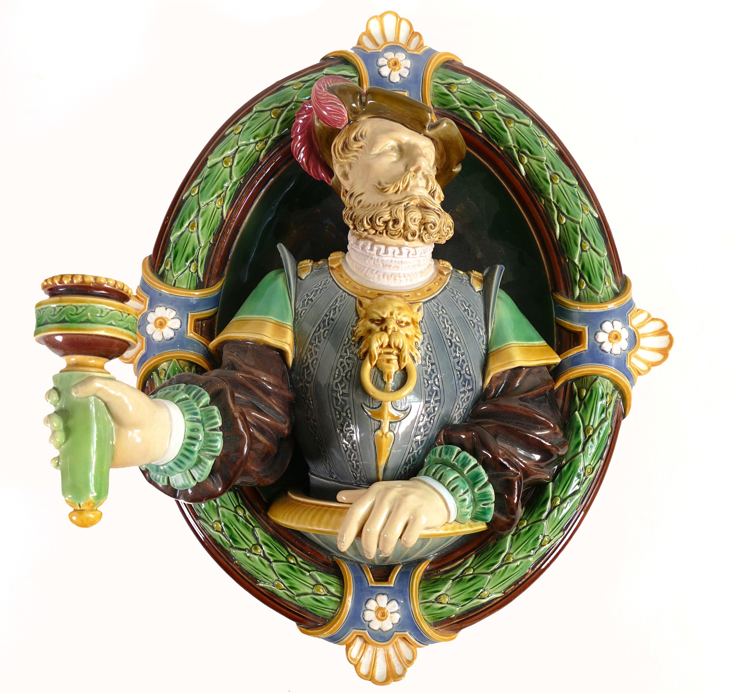 Minton Majolica wall sconce, in the form of a Renaissance man holding a torch, set in oval laurel