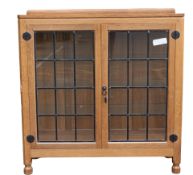 Robert "Mouseman" Thompson (1876-1955), two door display cabinet with leaded glass, c1990s, w.107