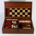 Edwardian Mahogany cased games compendium set, comprising original Chess/Draughts sets, dominoes