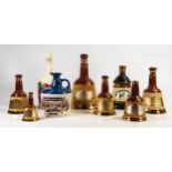 A collection of Wade decanters to include - Bells in various sizes, Christmas 1990 and Lambs Navy