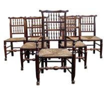 Seven 19th century rush seated Ash dining chairs including one carver (7)