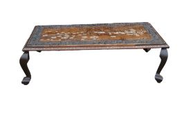 Large Indian carved coffee table, inlaid with elephants in their natural habitat. Later adapted to a