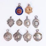 A good collection of silver shield medals including enamelled Staffordshire County Bowling badge,