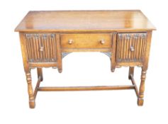 Good quality reproduction Oak Linenfold desk, length 107cm, height 77cm & depth 53cm