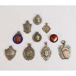 A good collection of silver shield medals including enamelled Staffordshire County Bowling badge,