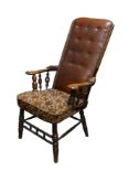 19th century upholstered armchair on turned legs and arm supports, high buttoned leather back