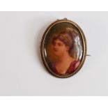 9ct gold mounted brooch hand painted with a lady by Leslie Johnson, h.4cm.