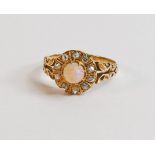 18ct gold ring set with central opal surrounded by 10 diamonds, 3.6g. Ring size R