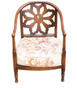 Early 20th century oak arm chair with upholstered cushion seat.
