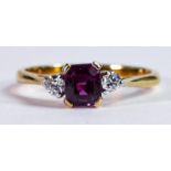 18ct gold ring set with centre square cut ruby with diamond on each side, size N, 2.7g.