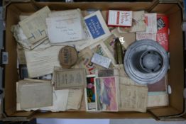A mixed collection of items to include WW2 military ephemera, trench art lighters, WW1 postcards etc