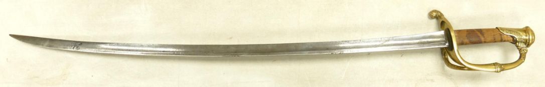 Late 19th century, brass hilted sabre. Outer grip missing exposing original wooden grip. Blade
