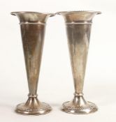 Pair filled silver fluted vases dated 1921, h.19cm, gross weight 561.7g. Some damage noted - one