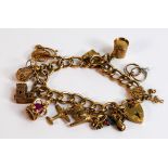 9ct gold bracelet with 11 good quality 9ct gold charms, 37g.