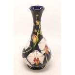 Moorcroft vase decorated in the Chatsworth Orchid design by Phillip Gibson, dated 2001 ,h.23.5cm,