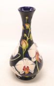 Moorcroft vase decorated in the Chatsworth Orchid design by Phillip Gibson, dated 2001 ,h.23.5cm,