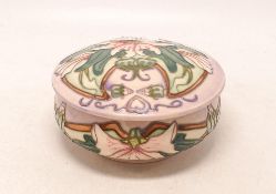 Moorcroft floral decorated lidded pot. Height 7cm, dated 2000. Boxed