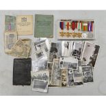 A collection of medals and items belonging to a soldier, including a 1996 replacement/replica