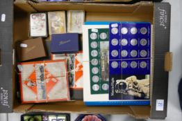 A mixed collection of items to include vintage monopoly game, collectable Esso token sets, vintage