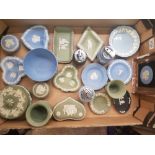 A collection of Wedgwood Jasper Ware items to include table lighters, lidded trinket boxes, framed