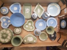 A collection of Wedgwood Jasper Ware items to include table lighters, lidded trinket boxes, framed