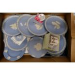 A collection of 8 Wedgwood Blue Jasper Christmas Plates together with similar mug & lidded box