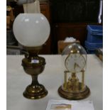 Brass effect Valor oil lamp with shade and funnel together with Bentima glassed domed clock , height