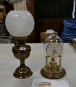 Brass effect Valor oil lamp with shade and funnel together with Bentima glassed domed clock , height