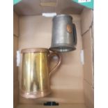 A pewter tankard together with a Victorian copper and brass Quart measure/tankard (2).