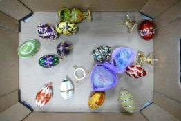 A collection of Decorative Jewelled & Enamelled Eggs & Stands (some opening)