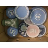 A collection of Wedgwood jasperware to include lilac plate, pink plate, sage green vase, footed bowl