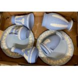 A collection of wedgewood to include blue jasperware vases, blue jasperware jug, and two blue