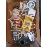 A collection of Wade Items to including Novelty & Collectable Teapots. These were removed from the