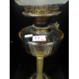 Early 20th Century Glass and Brass Oil Lamp in Collum form. Overall Height Includung Chimney 74cm