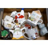 A collection of Wade Items to including Novelty & Collectable Teapots & Moneybox. These were removed