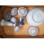 A collection of Wedgwood jasperware items to include two cup and saucers, lidded pot, pin dishes,