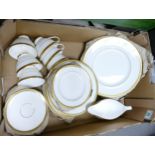 Royal Doulton Royal Gold tea and dinner ware to include trio's, dinner plates, salad plates, gravy