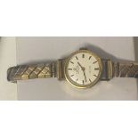 Ladies 9ct Gold cased Omega De Ville Automatic watch on expanding gold plated bracelet.