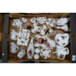 A mixed collection of Royal Albert old country roses to include mantle clock, ornamental animals,