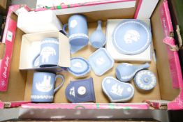 Wedgwood jasper ware to include tankards, boxed plate, dipped blue mantle clock, lidded boxes